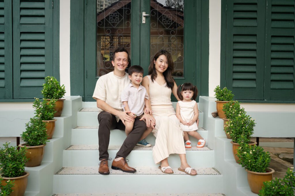 Portrait of a Singaporean family in a professional studio setting