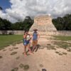 Tourists enjoying a guided tour of a historical site in Yucatan.